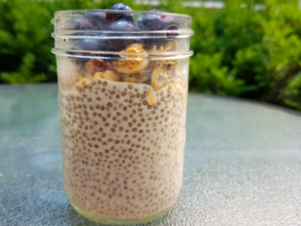 Chia Seed Pudding with Granola and Berries in a Mason Jar